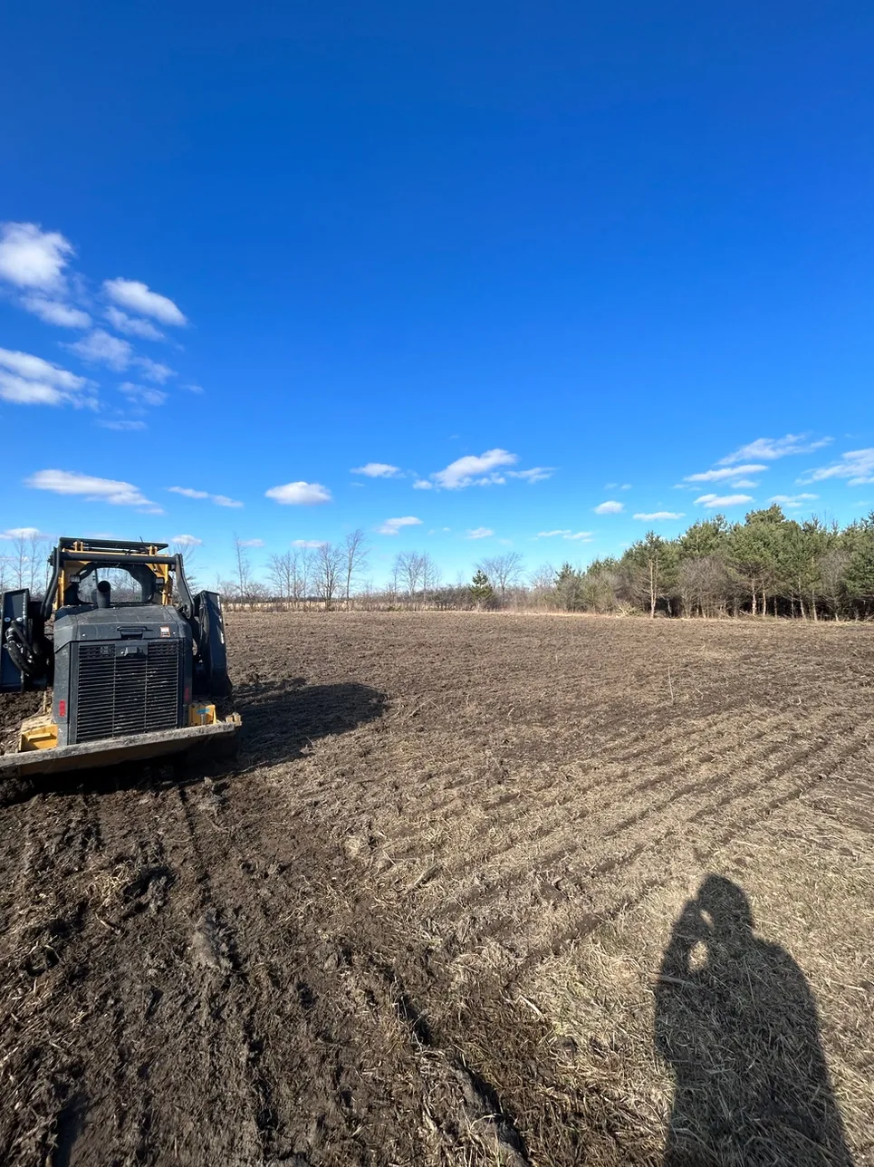 Land clearing in an open Michigan field
