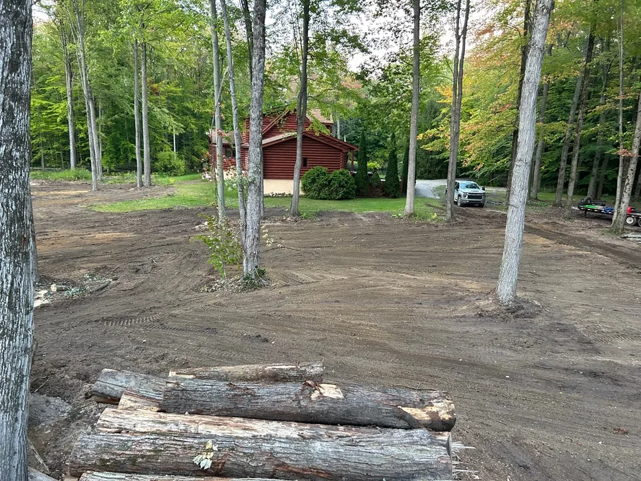 Cleared and graded yard around a log home